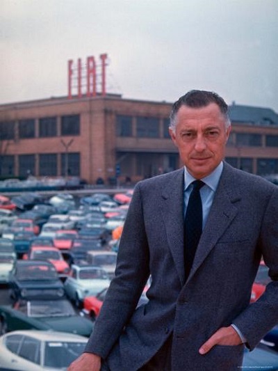 president-of-fiat-gianni-agnelli-standing-with-cars-and-fiat-factory.jpg